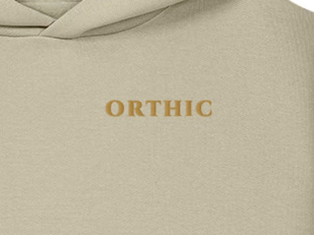 Atelier Sculpted Hoodie by ORTHIC in Stone, gold chest embroidery close-up