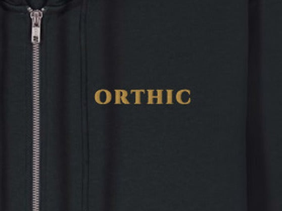 Atelier Zip Hoodie by ORTHIC in Black, gold chest embroidery close-up