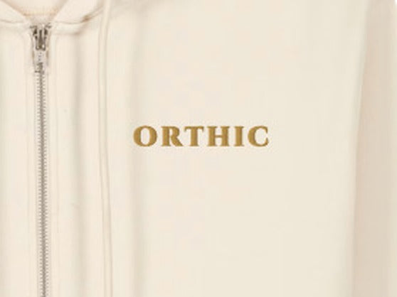 Atelier Zip Hoodie by ORTHIC in Natural Raw, gold chest embroidery close-up
